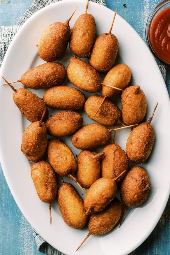 Little smokies corn dog bites are little smokie sausages dipped in a crispy corn dog batter and then fried to perfection.