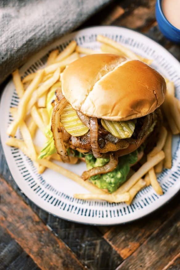 Mustard lined ground chuck, grilled onions and a secret sauce. These are all I need to make the best backyard grilled burger that is sure to be a crowd pleaser. 