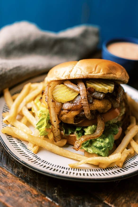 Mustard lined ground chuck, grilled onions and a secret sauce. These are all I need to make the best backyard grilled burger that is sure to be a crowd pleaser. 